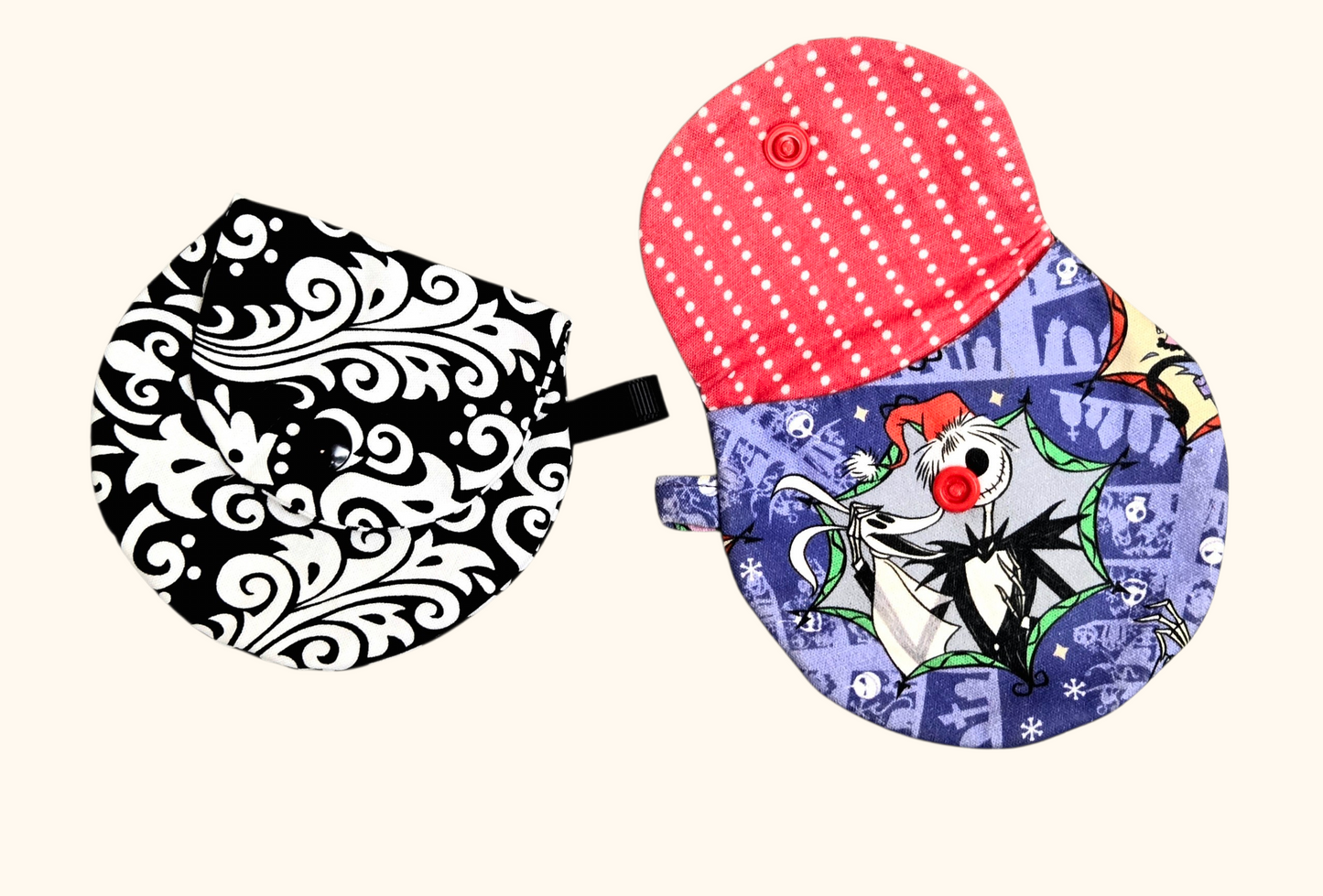 Two oven mitts with different designs on a white background