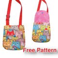 A small multicolored fabric bag with a cat pattern, featuring a red strap and a snap closure, indicating it is a free pattern version.